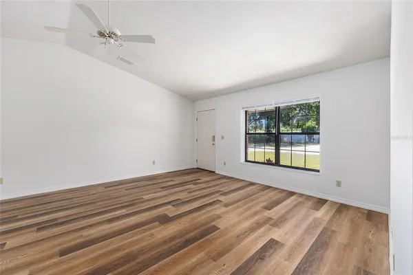 a view of an empty room with a window