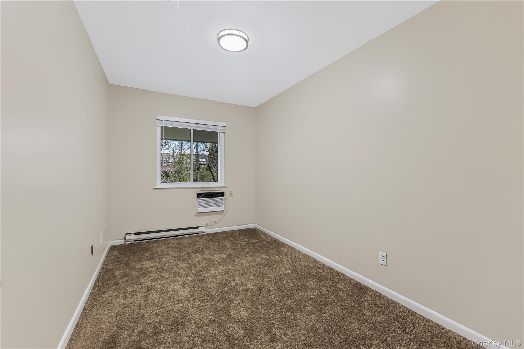 914 Old Country Road Elmsford, NY 10523 - Photo 14 of 21 an empty room with windows