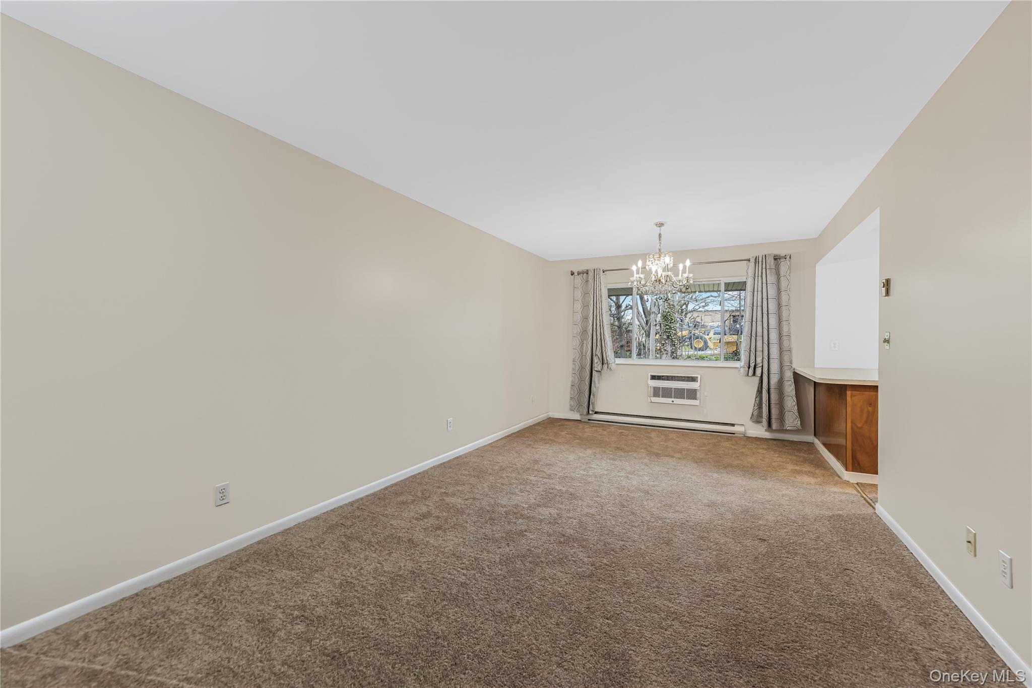 914 Old Country Road Elmsford, NY 10523 - Photo 5 of 21 an empty room with windows