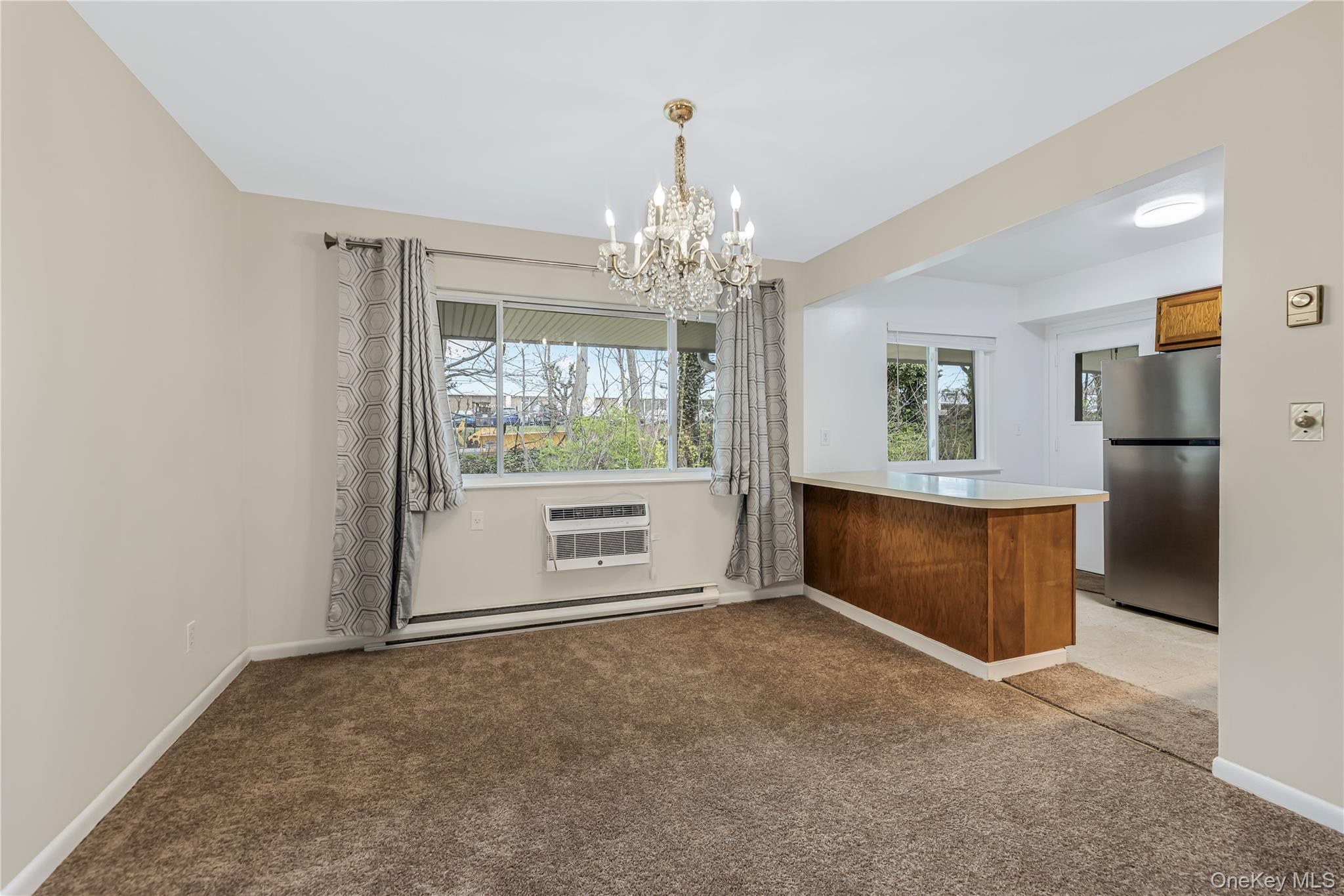 914 Old Country Road Elmsford, NY 10523 - Photo 7 of 21 a view of an empty room with a window