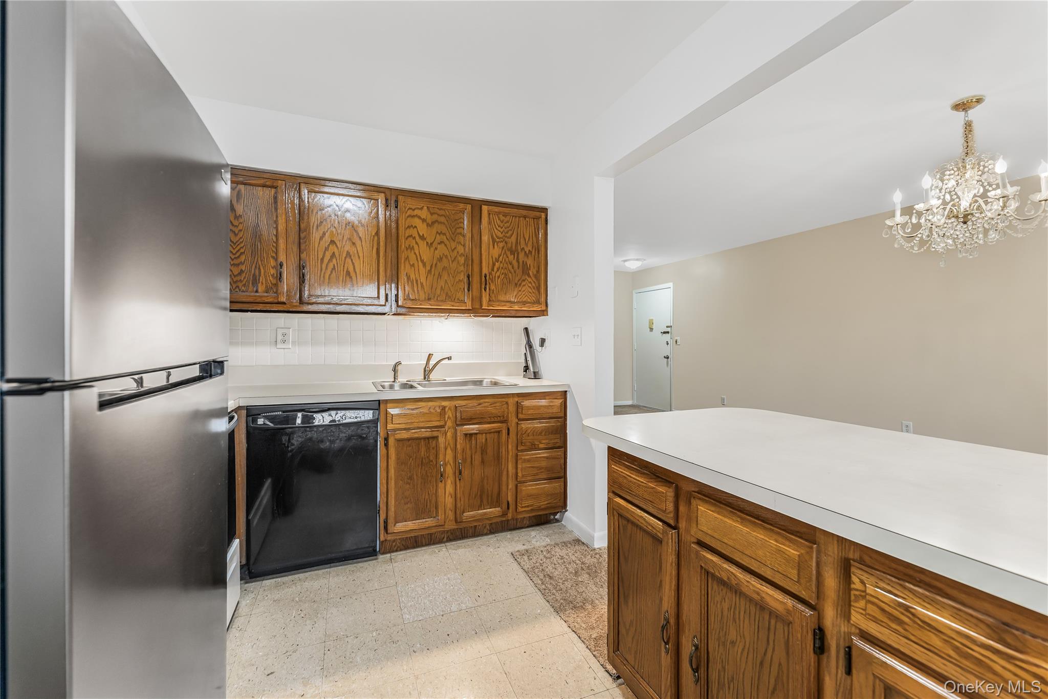 914 Old Country Road Elmsford, NY 10523 - Photo 9 of 21 a kitchen with stainless steel appliances granite countertop a sink stove and refrigerator