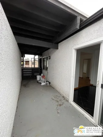 a view of room with stairs and furniture