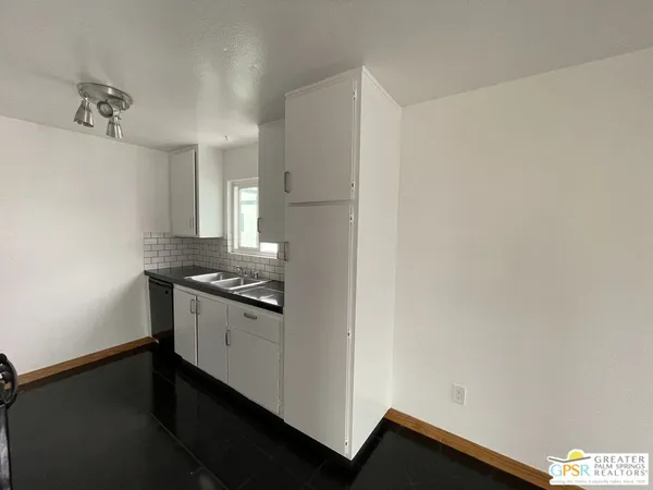 a view of a kitchen with a sink