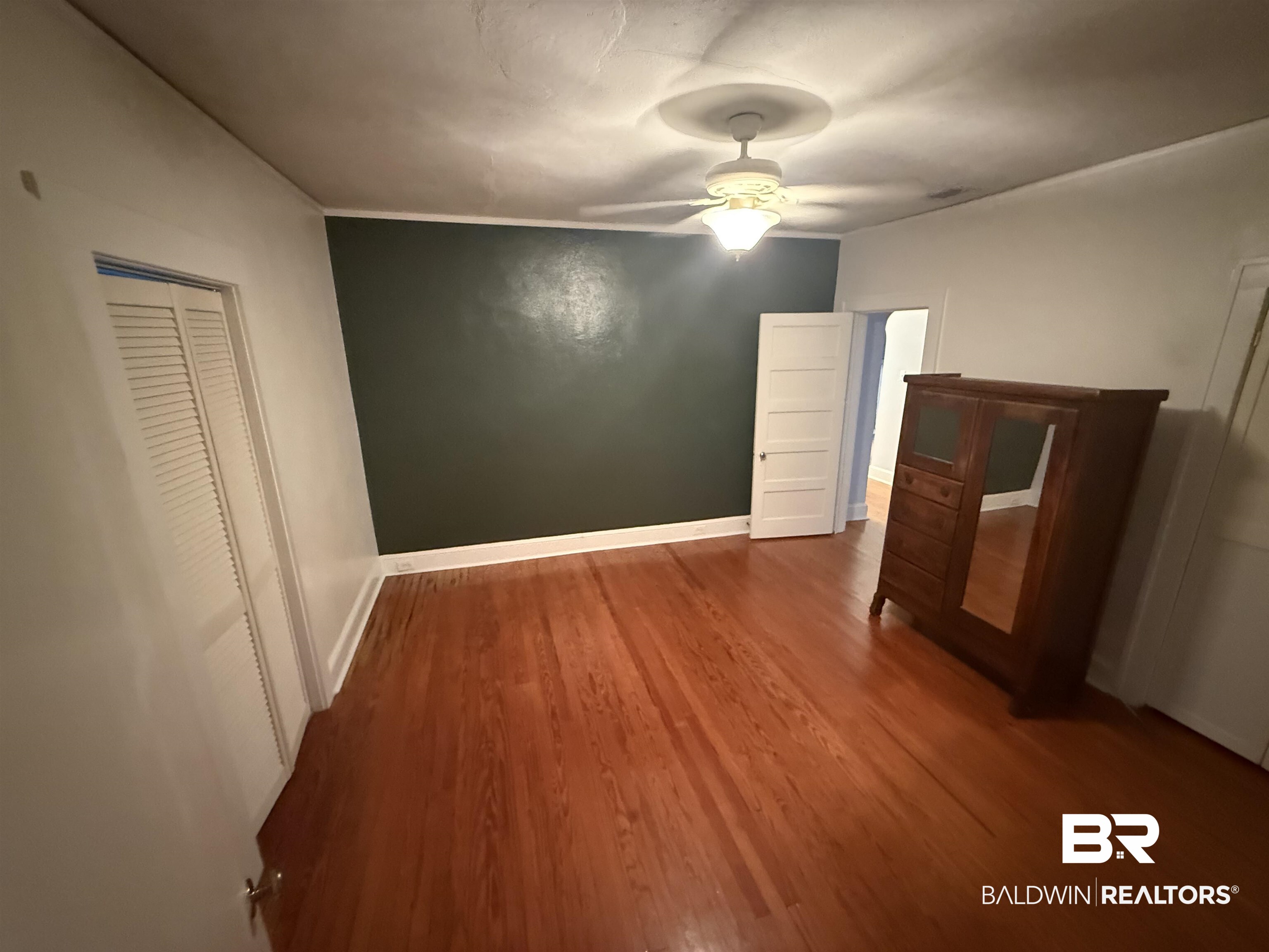 266 Westwood Street Mobile, AL 36606 - Photo 34 of 34 Unfurnished bedroom with wood finished floors and ceiling fan