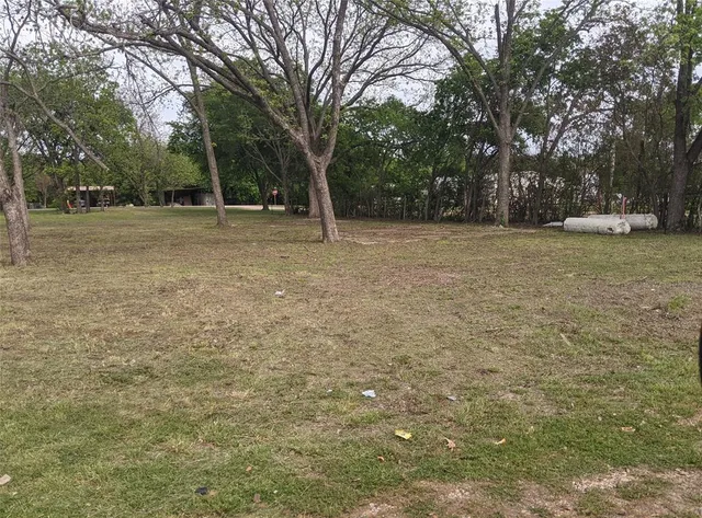 a view of outdoor space with deck and trees