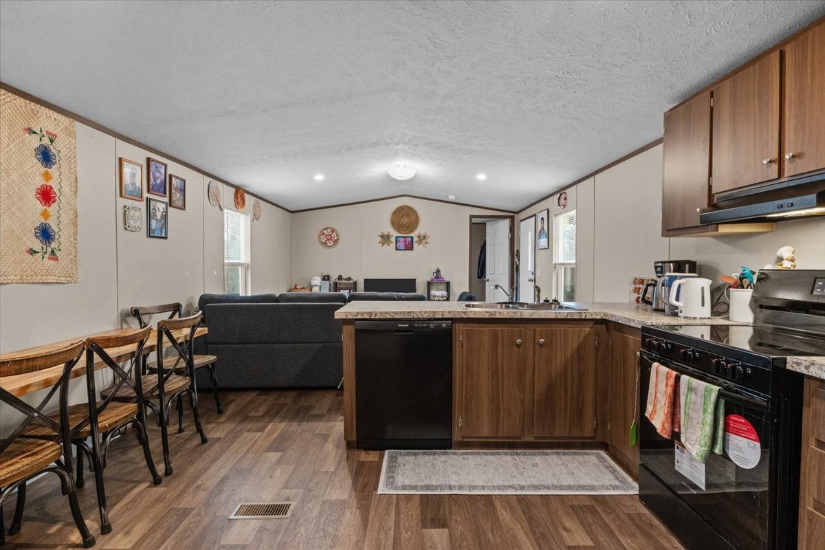 316 Friendship Drive Tennessee Ridge, TN 37178 - Photo 14 of 28 a kitchen with granite countertop lots of wooden cabinets a sink and appliances