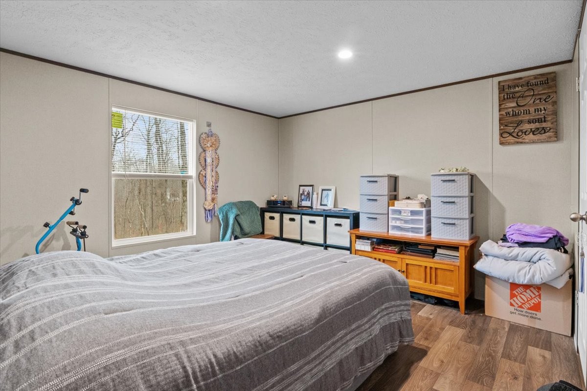 316 Friendship Drive Tennessee Ridge, TN 37178 - Photo 15 of 28 a bedroom with a bed and a window