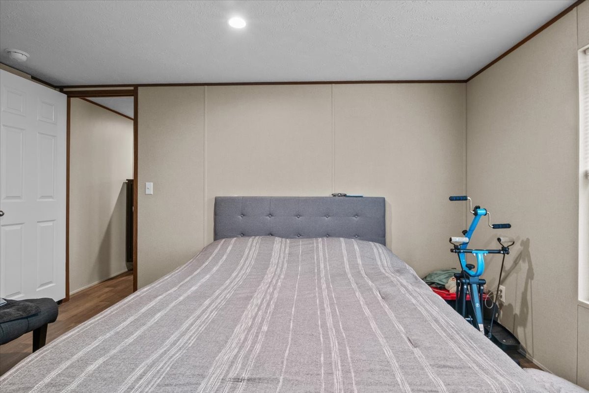 316 Friendship Drive Tennessee Ridge, TN 37178 - Photo 17 of 28 a bed sitting in a bedroom next to a window