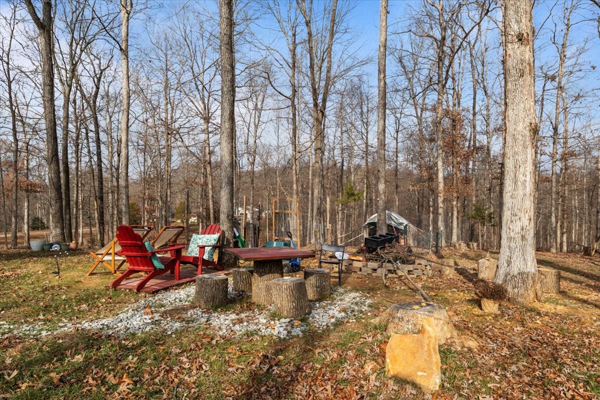 316 Friendship Drive Tennessee Ridge, TN 37178 - Photo 23 of 28 a backyard of a house with table and chairs