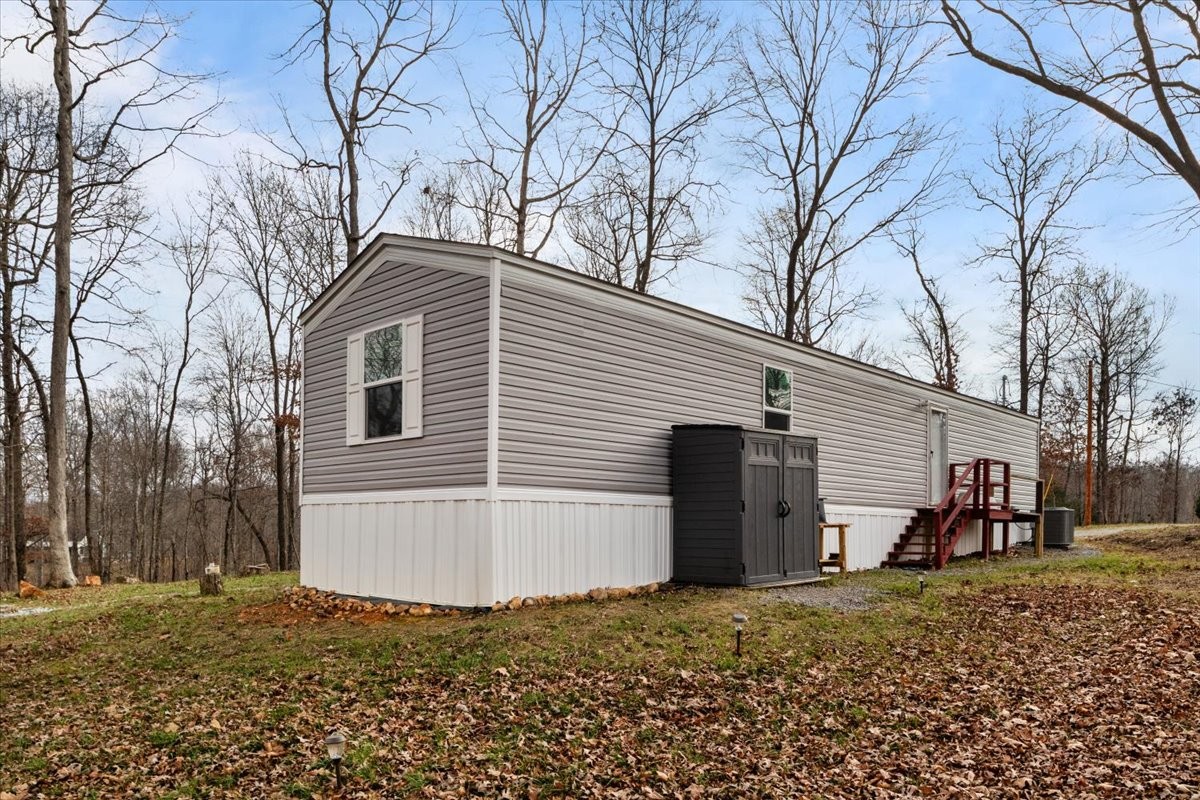 316 Friendship Drive Tennessee Ridge, TN 37178 - Photo 25 of 28 a view of a house with a yard
