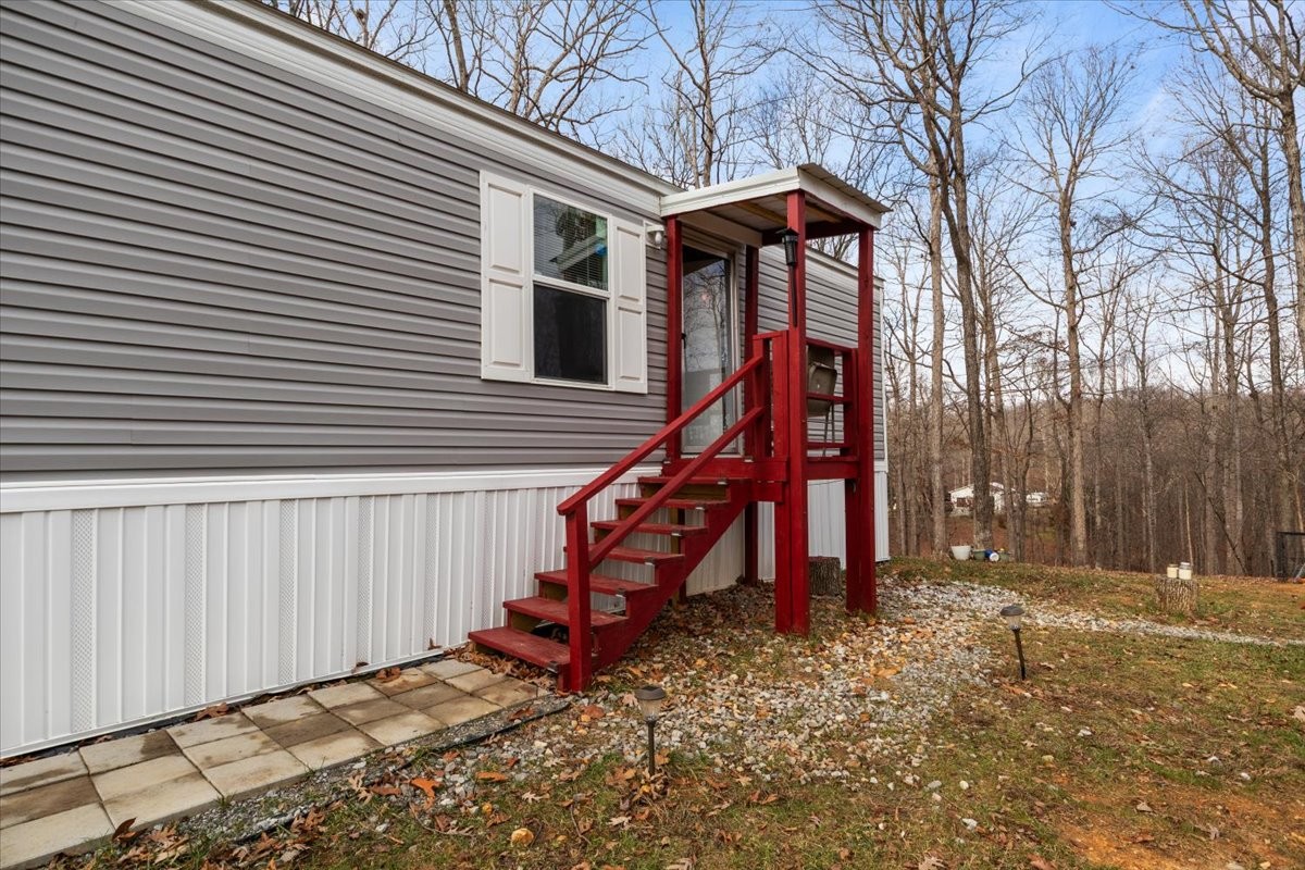316 Friendship Drive Tennessee Ridge, TN 37178 - Photo 5 of 28 a view of a house with a wooden bench