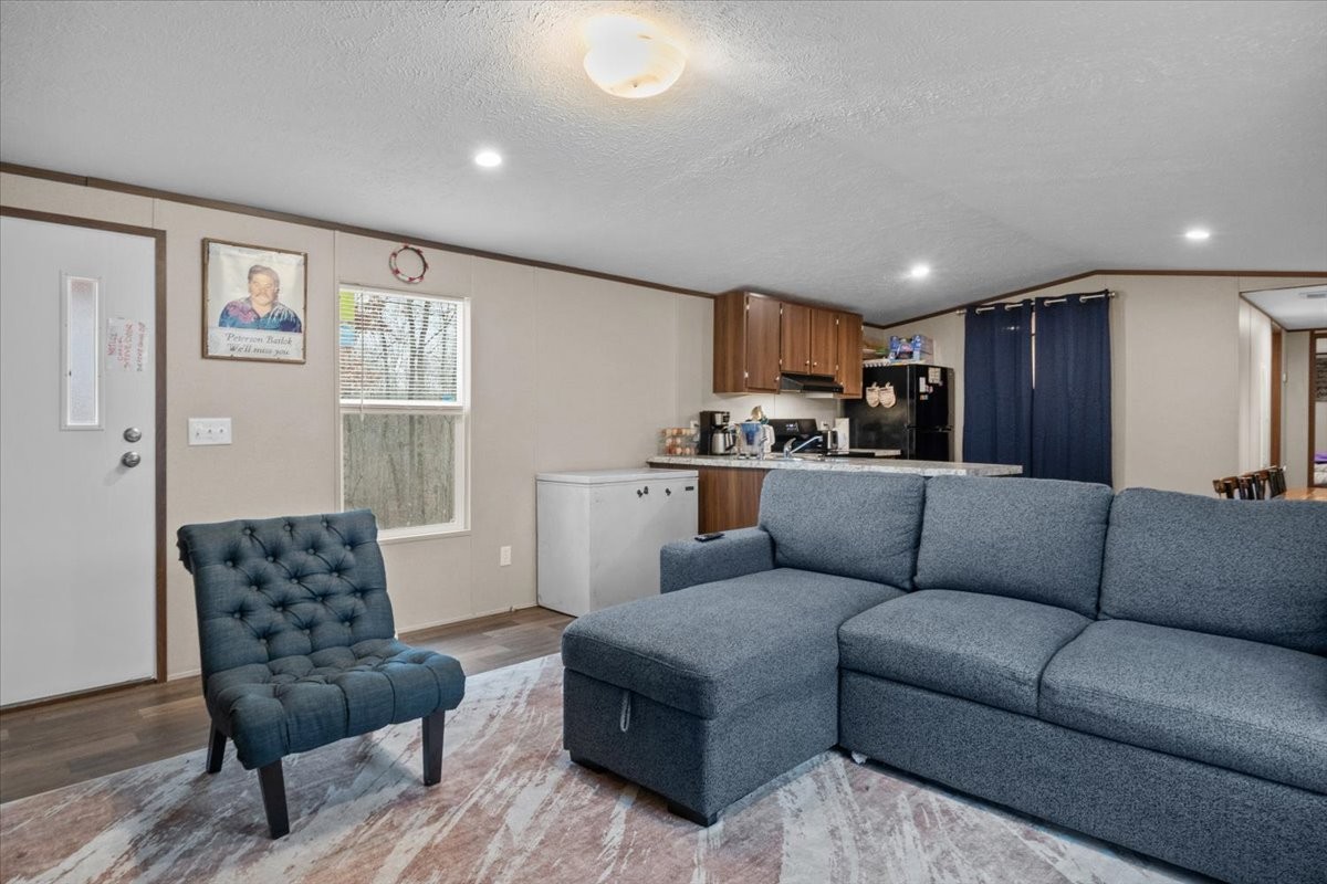 316 Friendship Drive Tennessee Ridge, TN 37178 - Photo 6 of 28 a living room with furniture and a dining table with kitchen view