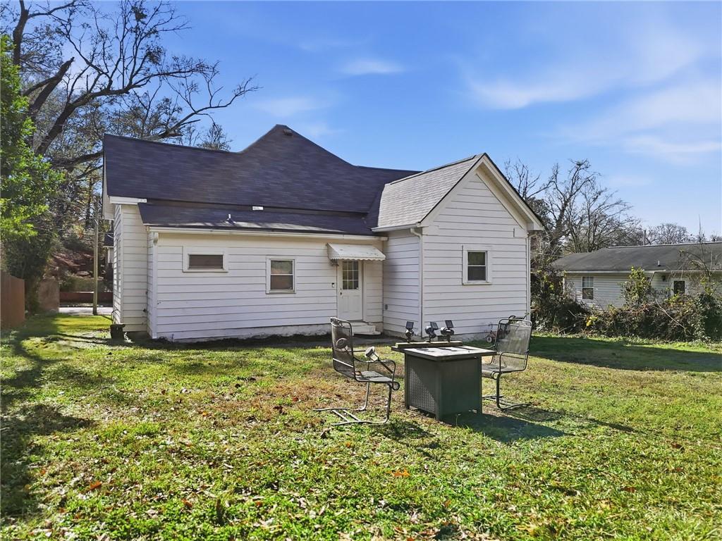 18 Butler Street Rome, GA 30161 - Photo 20 of 26 a view of a house with a yard and a garden