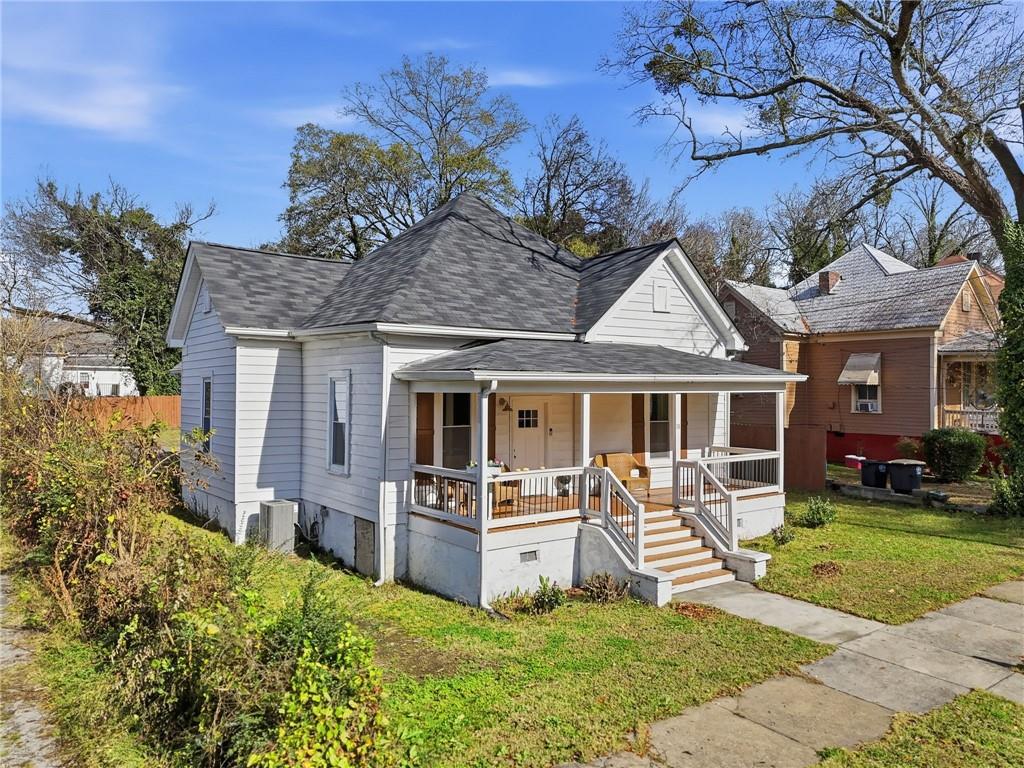 18 Butler Street Rome, GA 30161 - Photo 2 of 26 a front view of a house with a yard table and chairs