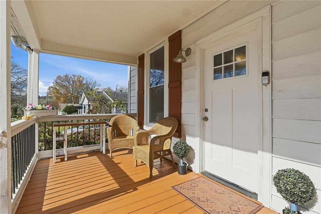 18 Butler Street Rome, GA 30161 - Photo 3 of 26 a balcony with wooden floor and furniture