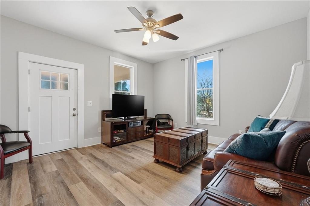 18 Butler Street Rome, GA 30161 - Photo 5 of 26 a living room with furniture and a flat screen tv