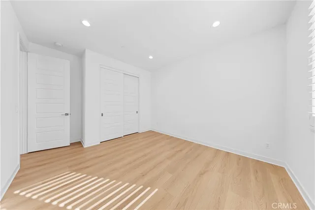 a vase of flowers sitting on a dining table with a window