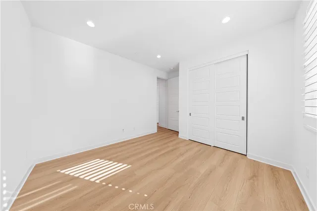 a bathroom with a sink a mirror and a potted plant