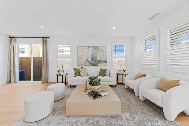 a kitchen with sink refrigerator dining table and chairs