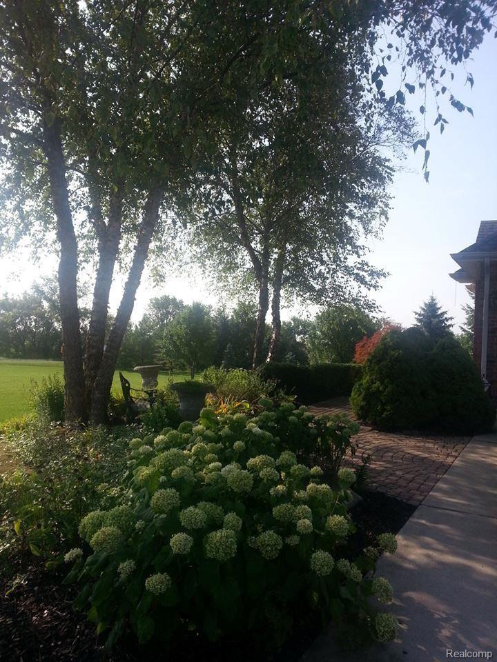 11453 Sweitzer Road Carleton, MI 48117 - Photo 24 of 43 front walk.jpg