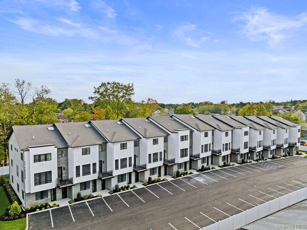 a aerial view of a houses with a city street