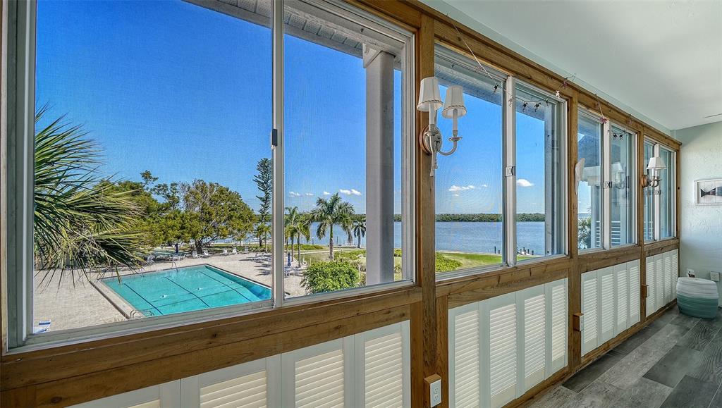 4440 Exeter Drive, Unit 301 Longboat Key, FL 34228 - Photo 24 of 72 a view of a porch and a yard