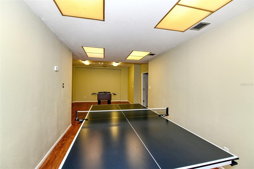 4440 Exeter Drive, Unit 301 Longboat Key, FL 34228 - Photo 38 of 72 a view of a hall with a black and white wall
