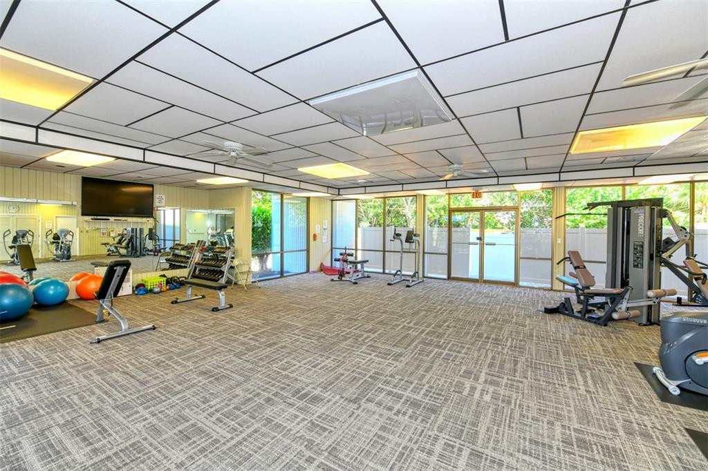 4440 Exeter Drive, Unit 301 Longboat Key, FL 34228 - Photo 41 of 72 a view of a room with gym equipment