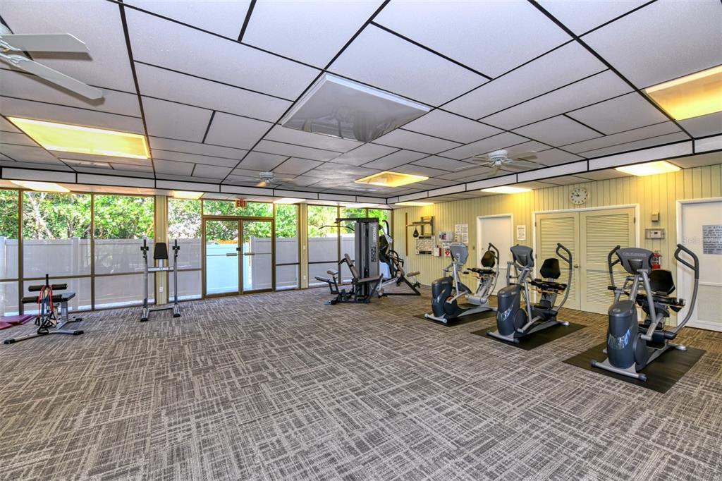4440 Exeter Drive, Unit 301 Longboat Key, FL 34228 - Photo 42 of 72 a view of a room with gym equipment