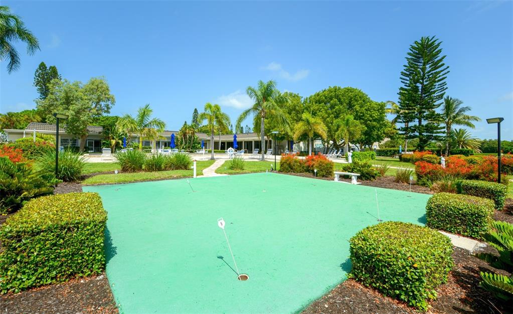 4440 Exeter Drive, Unit 301 Longboat Key, FL 34228 - Photo 49 of 72 a view of a garden with houses