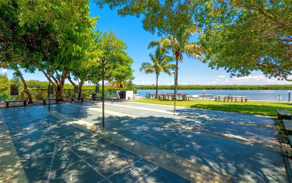 4440 Exeter Drive, Unit 301 Longboat Key, FL 34228 - Photo 50 of 72 a view of a park with trees