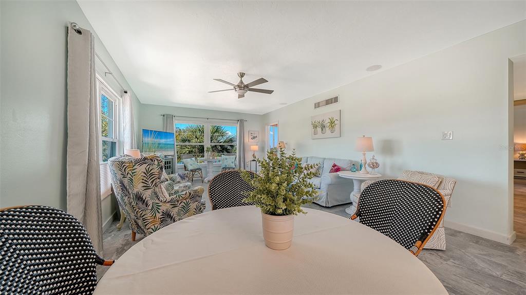4440 Exeter Drive, Unit 301 Longboat Key, FL 34228 - Photo 6 of 72 a view of a livingroom with furniture and wooden floor