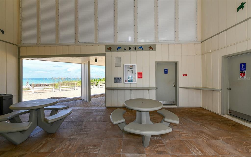 4440 Exeter Drive, Unit 301 Longboat Key, FL 34228 - Photo 66 of 72 a kitchen with a refrigerator and a stove