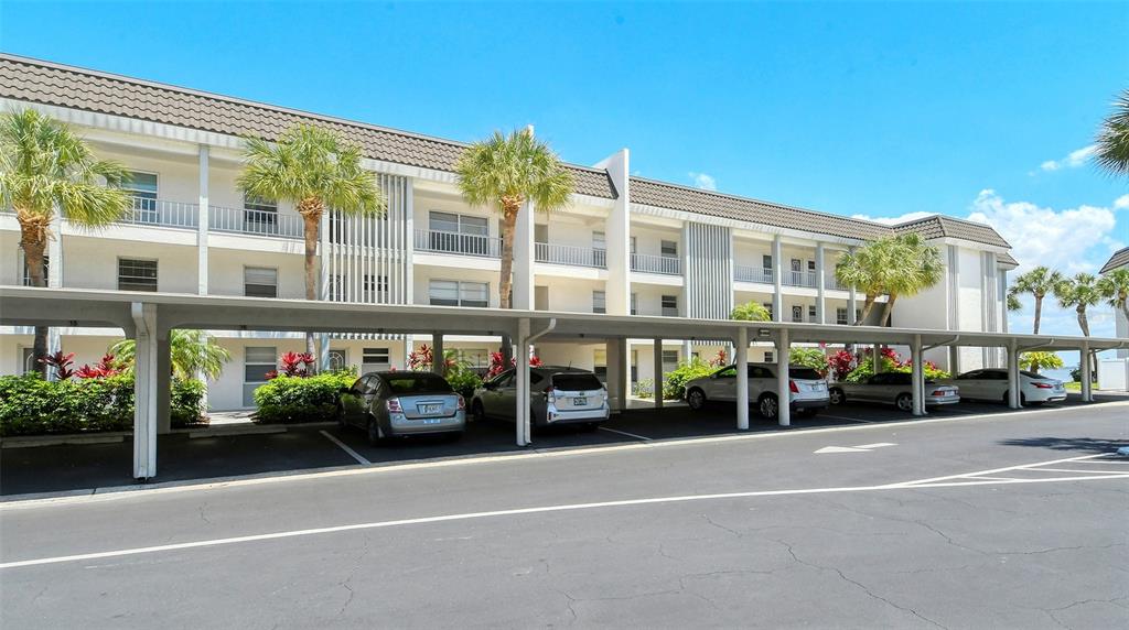 4440 Exeter Drive, Unit 301 Longboat Key, FL 34228 - Photo 71 of 72 a view of a building with a street