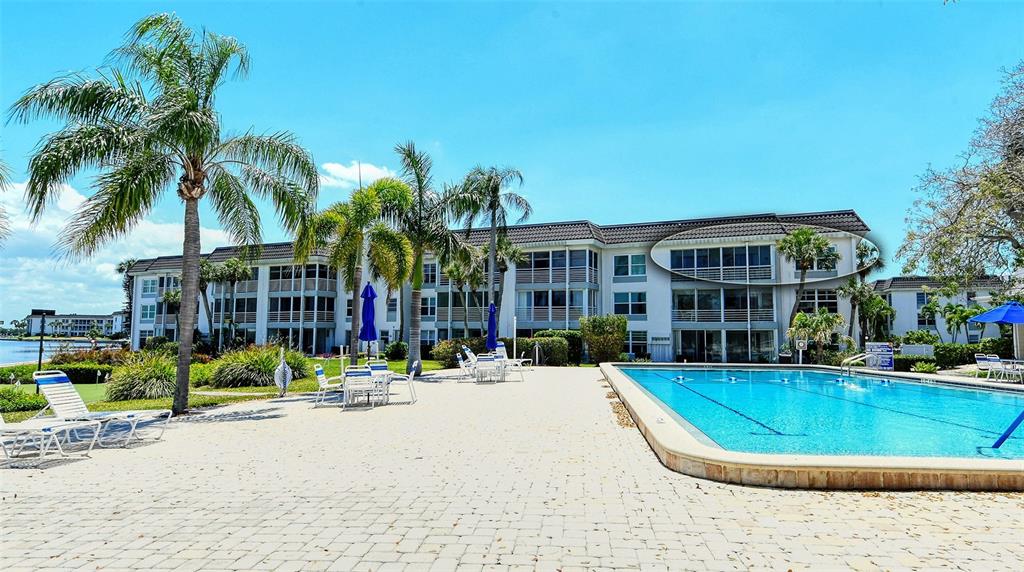 4440 Exeter Drive, Unit 301 Longboat Key, FL 34228 - Photo 72 of 72 a view of a building with a swimming pool
