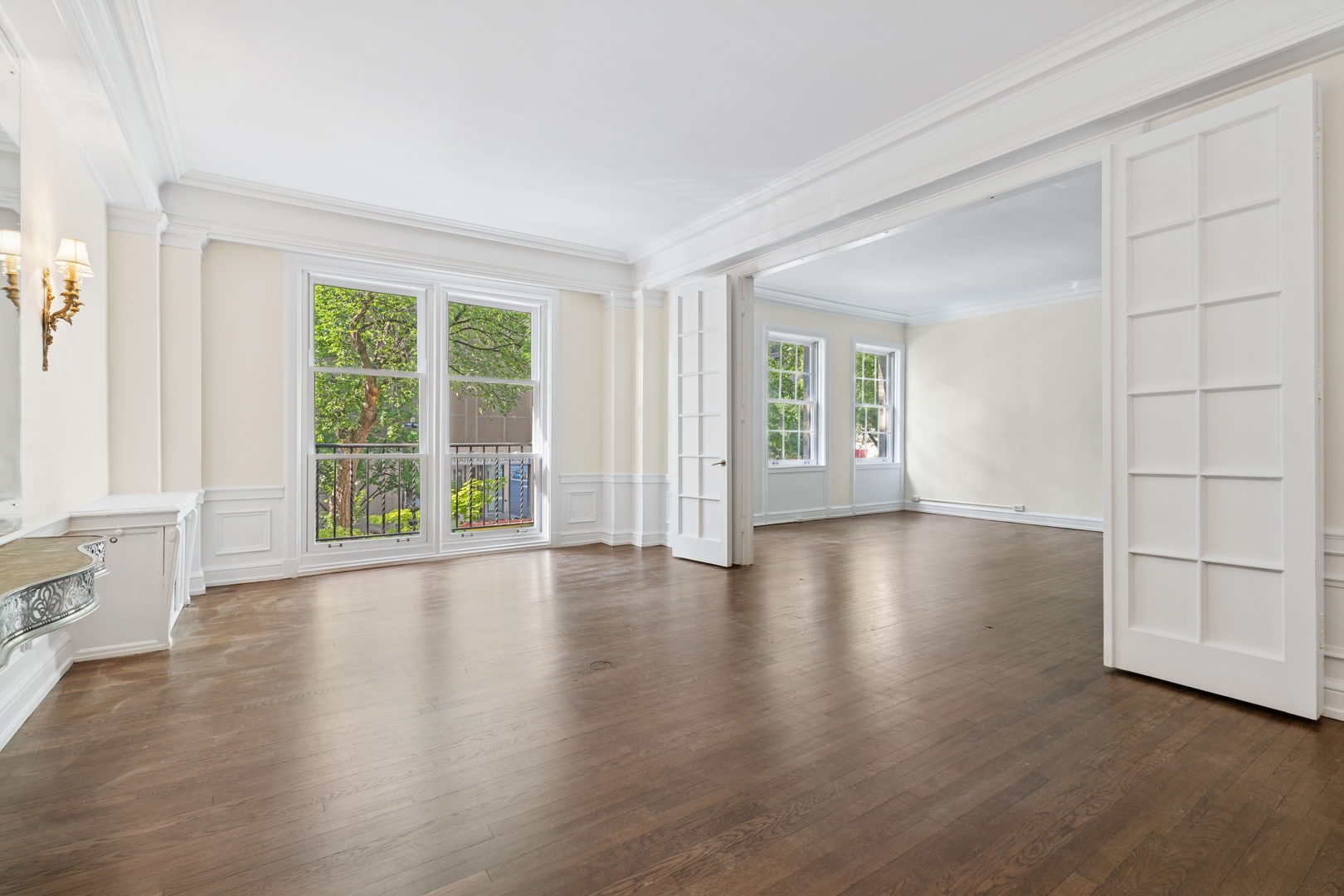200 East Pearson Street, Unit 2E Chicago, IL 60611 - Photo 12 of 25 an empty room with wooden floor and windows with curtains