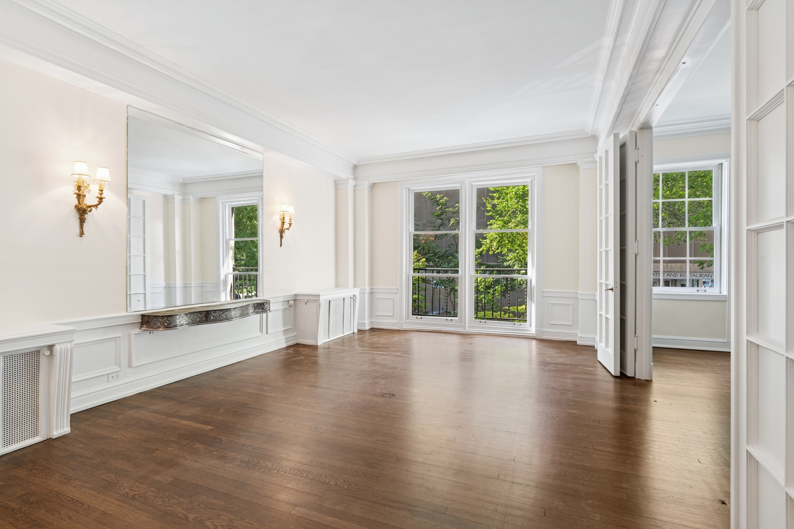200 East Pearson Street, Unit 2E Chicago, IL 60611 - Photo 13 of 25 a view of an empty room with wooden floor and a window