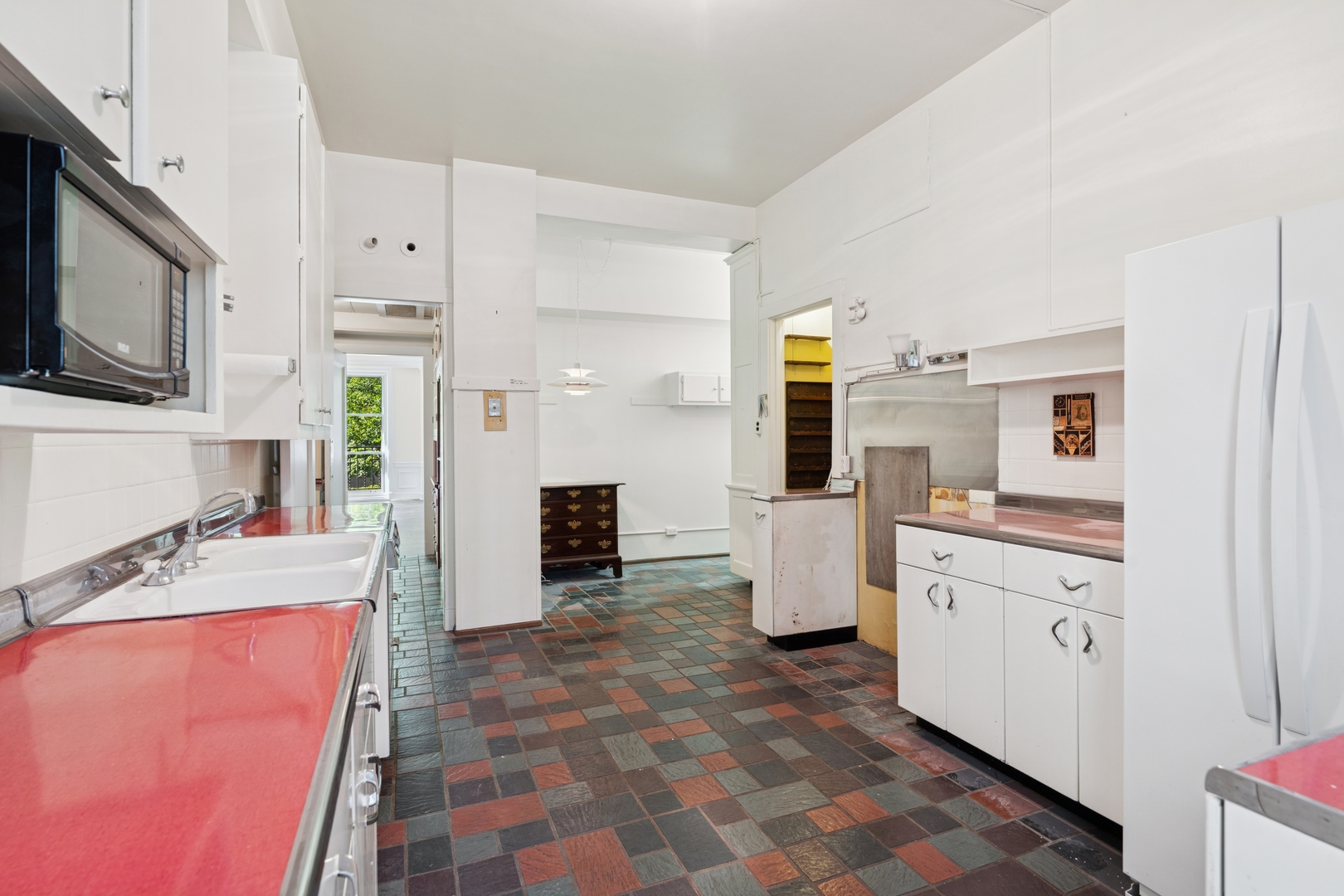 200 East Pearson Street, Unit 2E Chicago, IL 60611 - Photo 17 of 25 a kitchen with refrigerator and cabinets