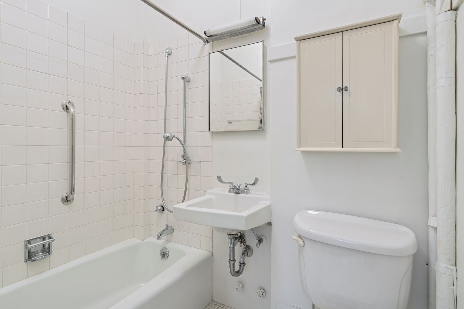 200 East Pearson Street, Unit 2E Chicago, IL 60611 - Photo 24 of 25 a bathroom with a sink a toilet and shower
