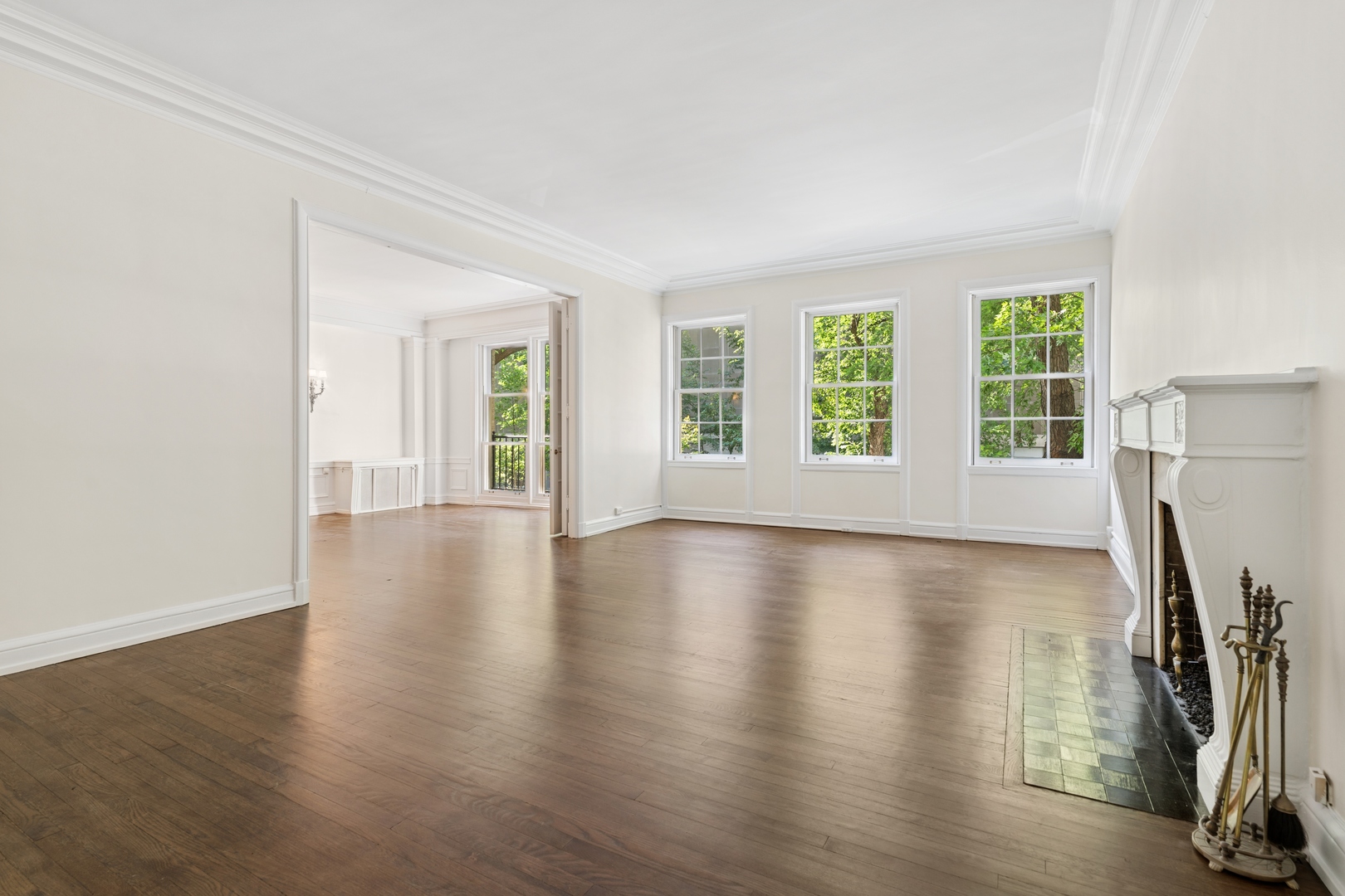 200 East Pearson Street, Unit 2E Chicago, IL 60611 - Photo 6 of 25 an empty room with wooden floor and windows