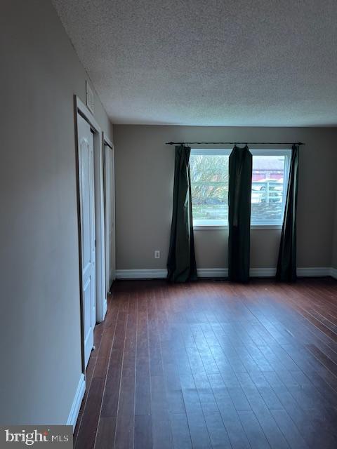 511 Chanticleer Cherry Hill, NJ 08003 - Photo 11 of 32 an empty room with wooden floor and windows
