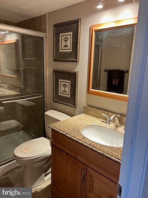 511 Chanticleer Cherry Hill, NJ 08003 - Photo 14 of 32 a bathroom with a granite countertop toilet sink and mirror
