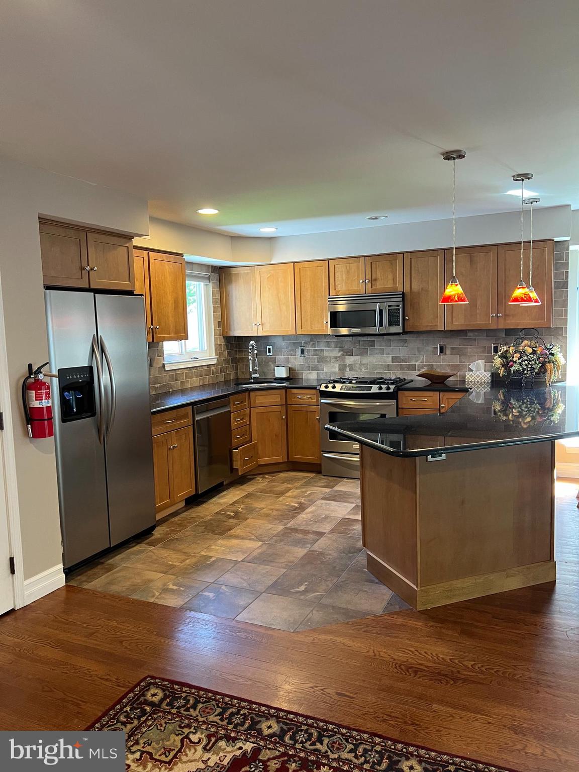 511 Chanticleer Cherry Hill, NJ 08003 - Photo 26 of 32 a kitchen with stainless steel appliances granite countertop a stove top oven a sink and a refrigerator