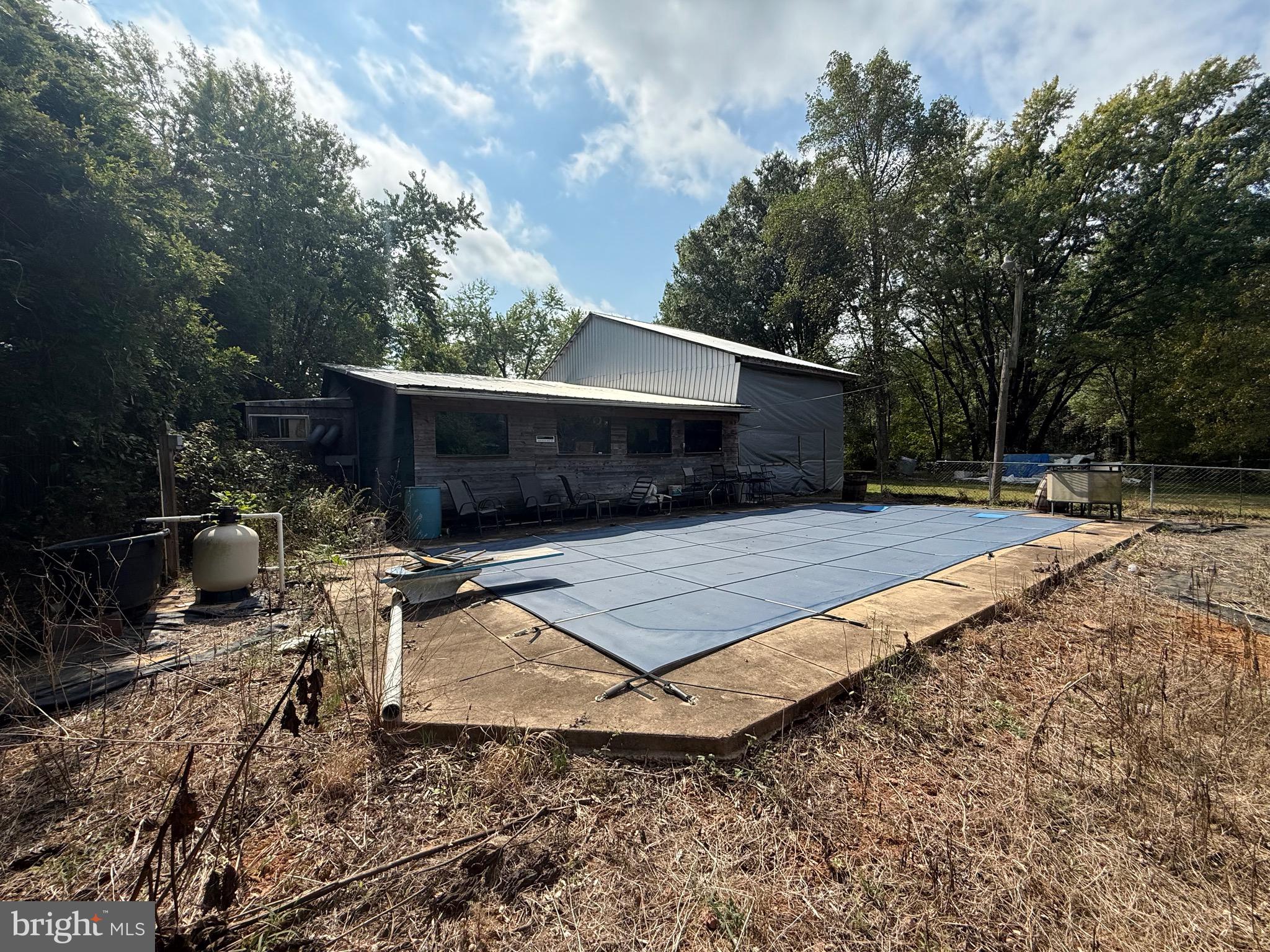 12400 Orchard Street Locust Grove, VA 22508 - Photo 2 of 13 a view of a backyard with a patio and a fire pit