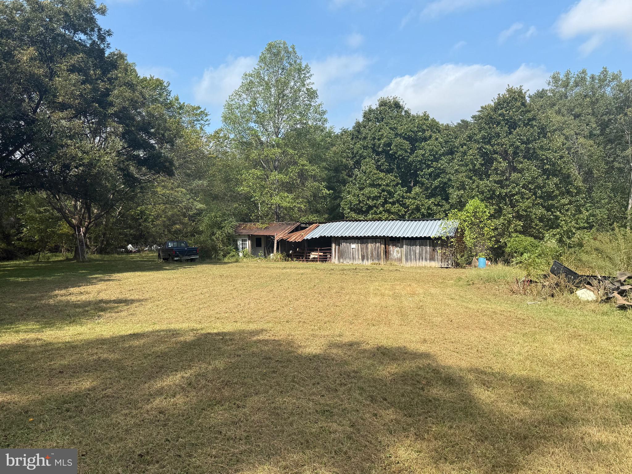 12400 Orchard Street Locust Grove, VA 22508 - Photo 4 of 13 a view of a house with pool and a yard