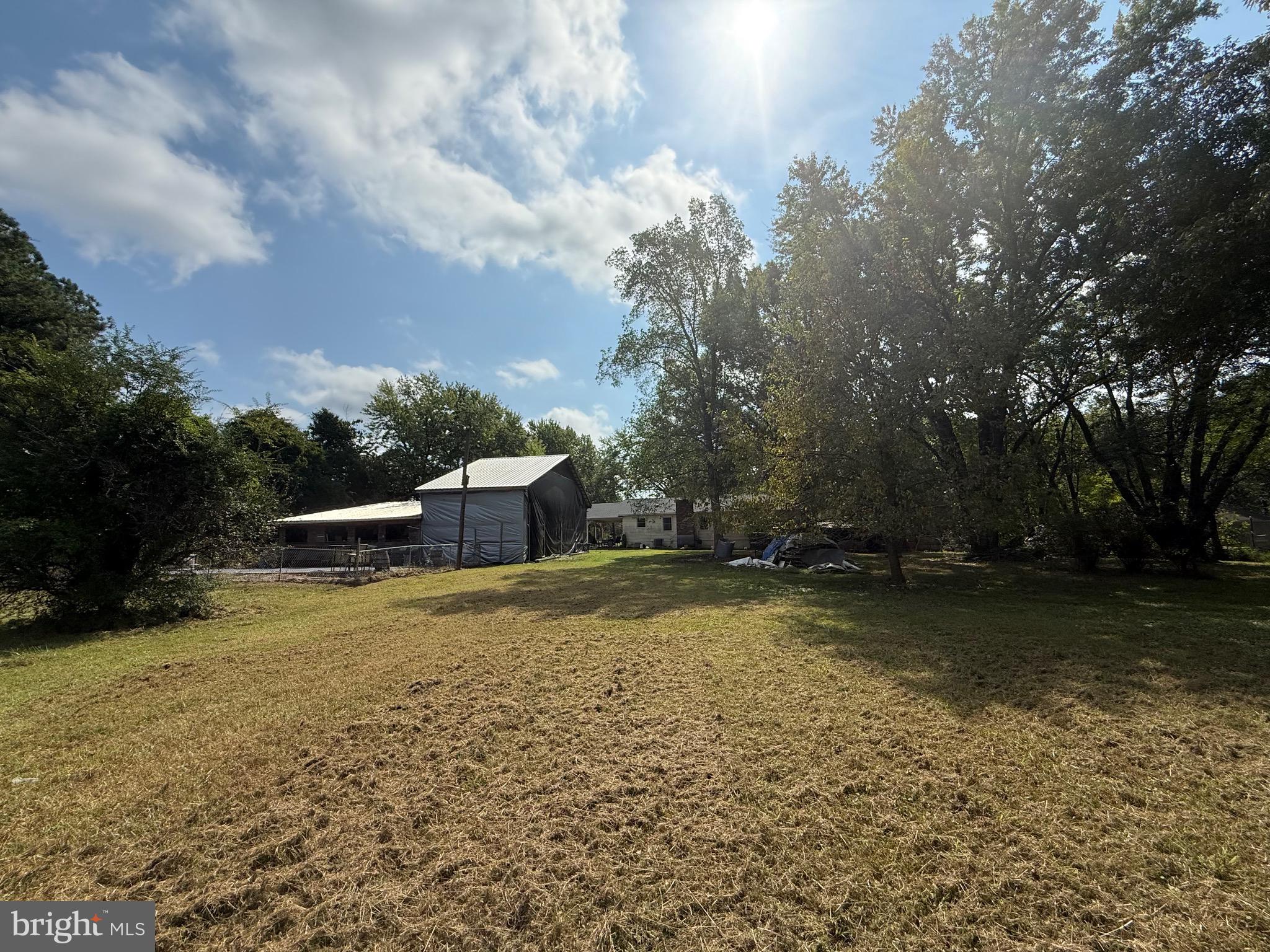 12400 Orchard Street Locust Grove, VA 22508 - Photo 6 of 13 a backyard of a house with a yard and outdoor seating