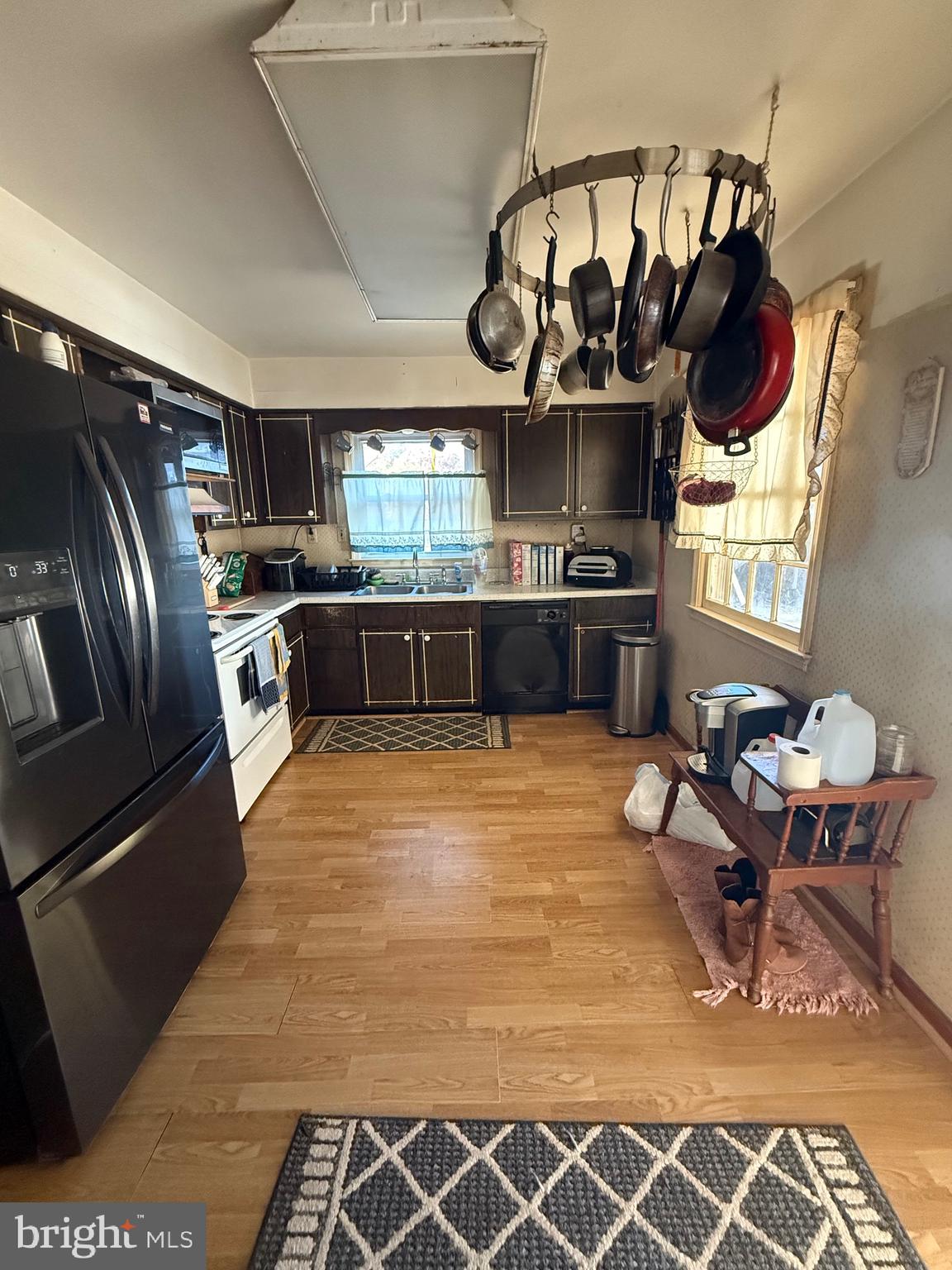 12400 Orchard Street Locust Grove, VA 22508 - Photo 8 of 13 a kitchen with stainless steel appliances granite countertop a sink wooden cabinets and stove