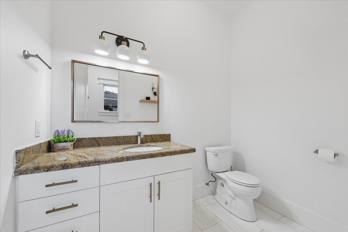 3535 Michaux Street Houston, TX 77009 - Photo 20 of 48 What is the first room every house needs immediately upon entry from the garage? It's the half bath. Kudos to the architect and builder who got this right!