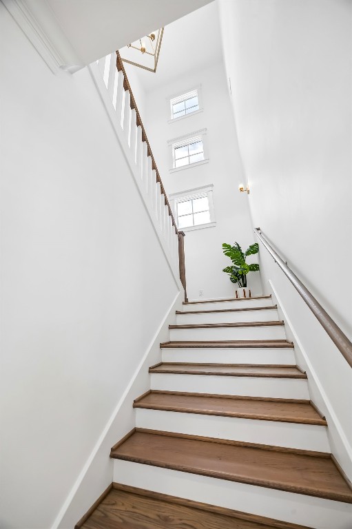 3535 Michaux Street Houston, TX 77009 - Photo 21 of 48 Three windows above the landing frame the stairwell and emphasize the home's impressive vertical scale.
