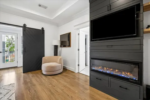 a bedroom with furniture and a window